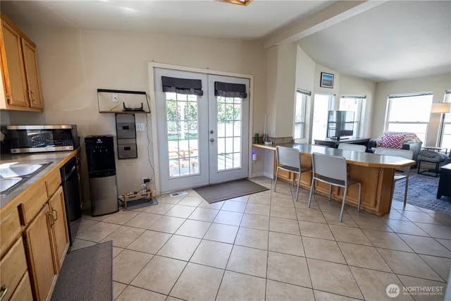 a kitchen with a sink a counter top space and appliances