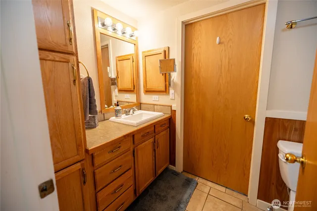 a bathroom with a double vanity sink and mirror