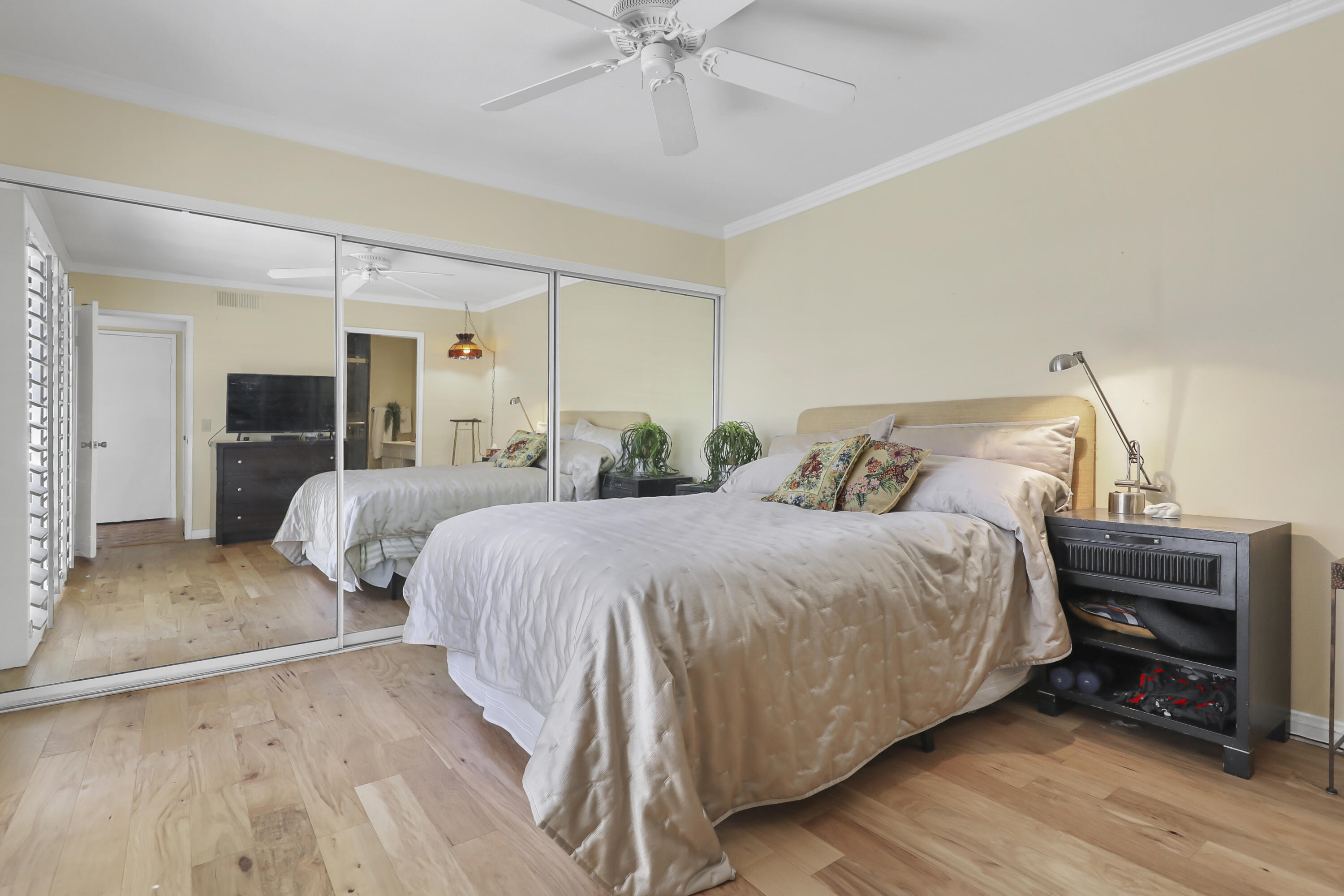 44 Malaga Drive Rancho Mirage, CA 92270 - Photo 11 of 22 a bedroom with a bed and a chandelier