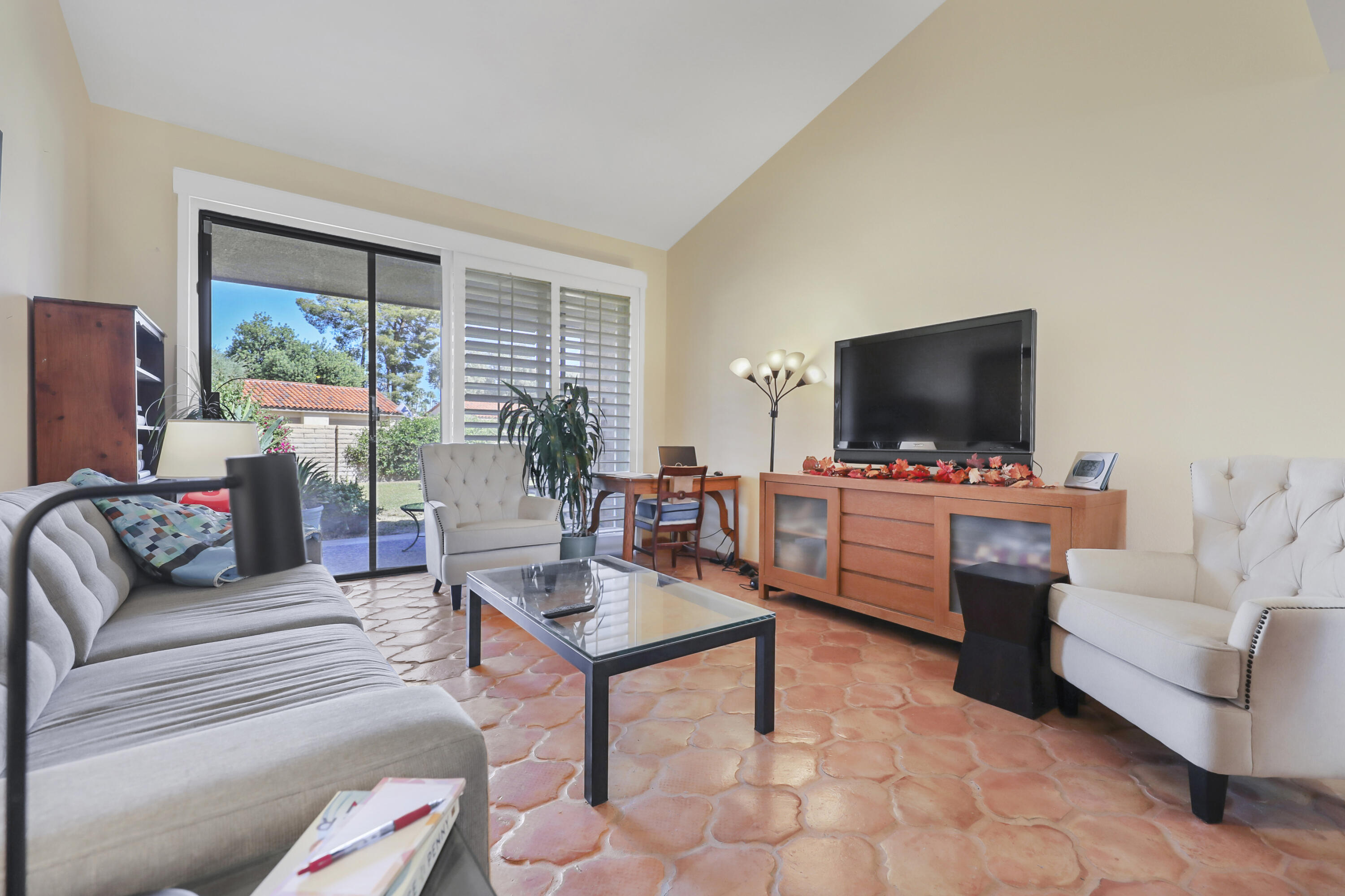 44 Malaga Drive Rancho Mirage, CA 92270 - Photo 2 of 22 a living room with furniture and a flat screen tv