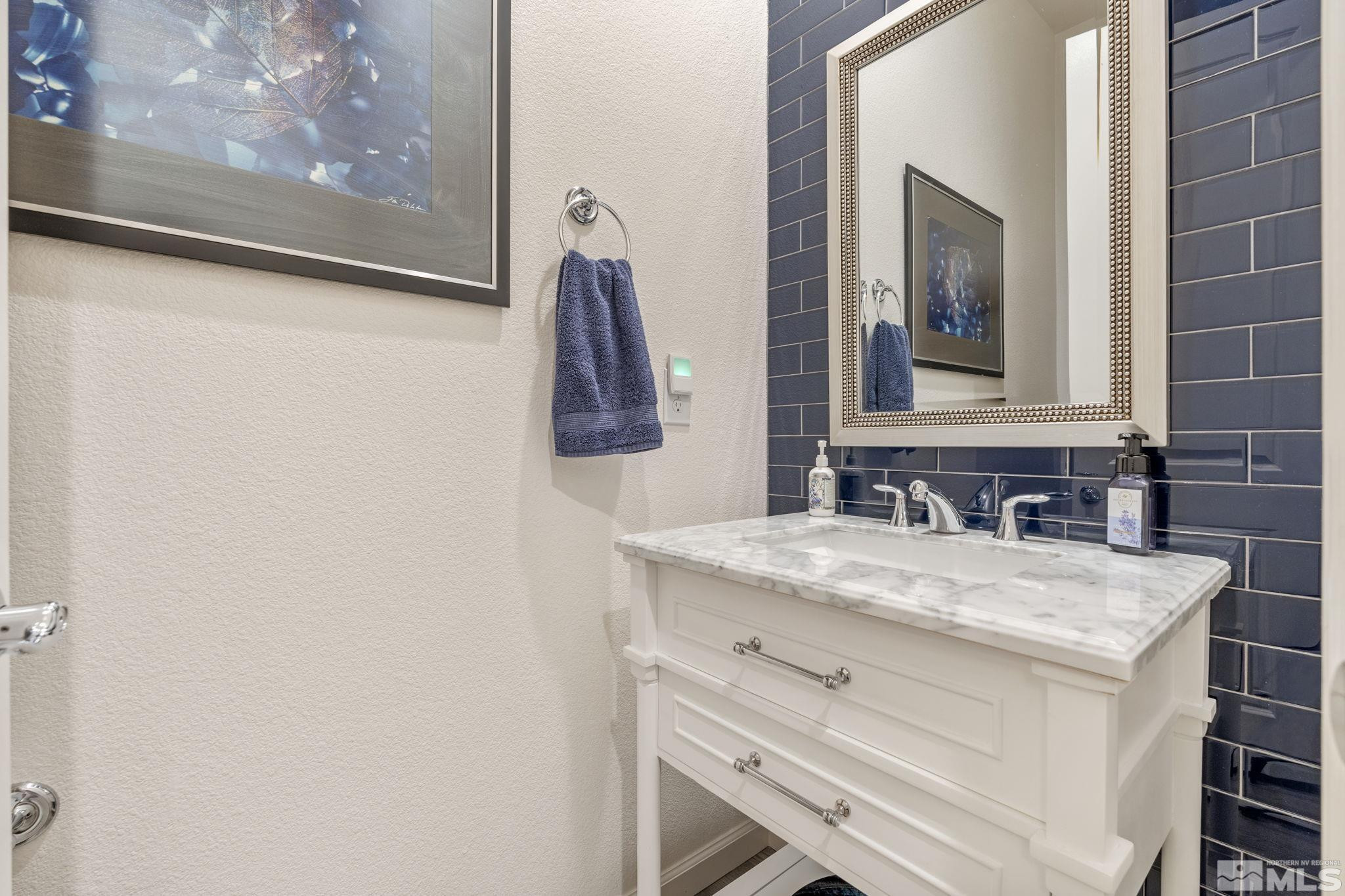 2445 Buttermere Court Reno, NV 89521 - Photo 29 of 39 a bathroom with a sink vanity and a mirror