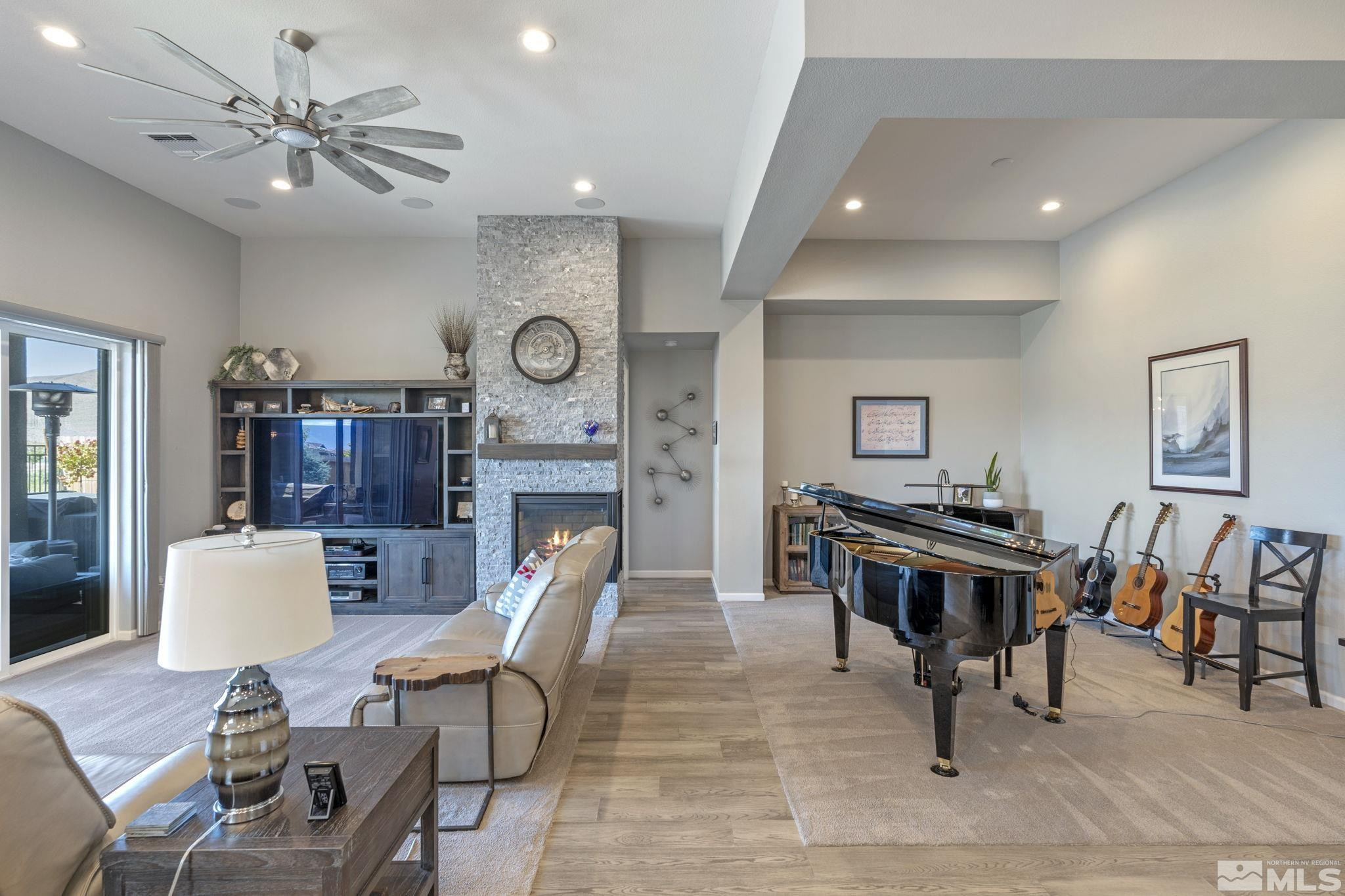 2445 Buttermere Court Reno, NV 89521 - Photo 3 of 39 a living room with furniture a clock and a table