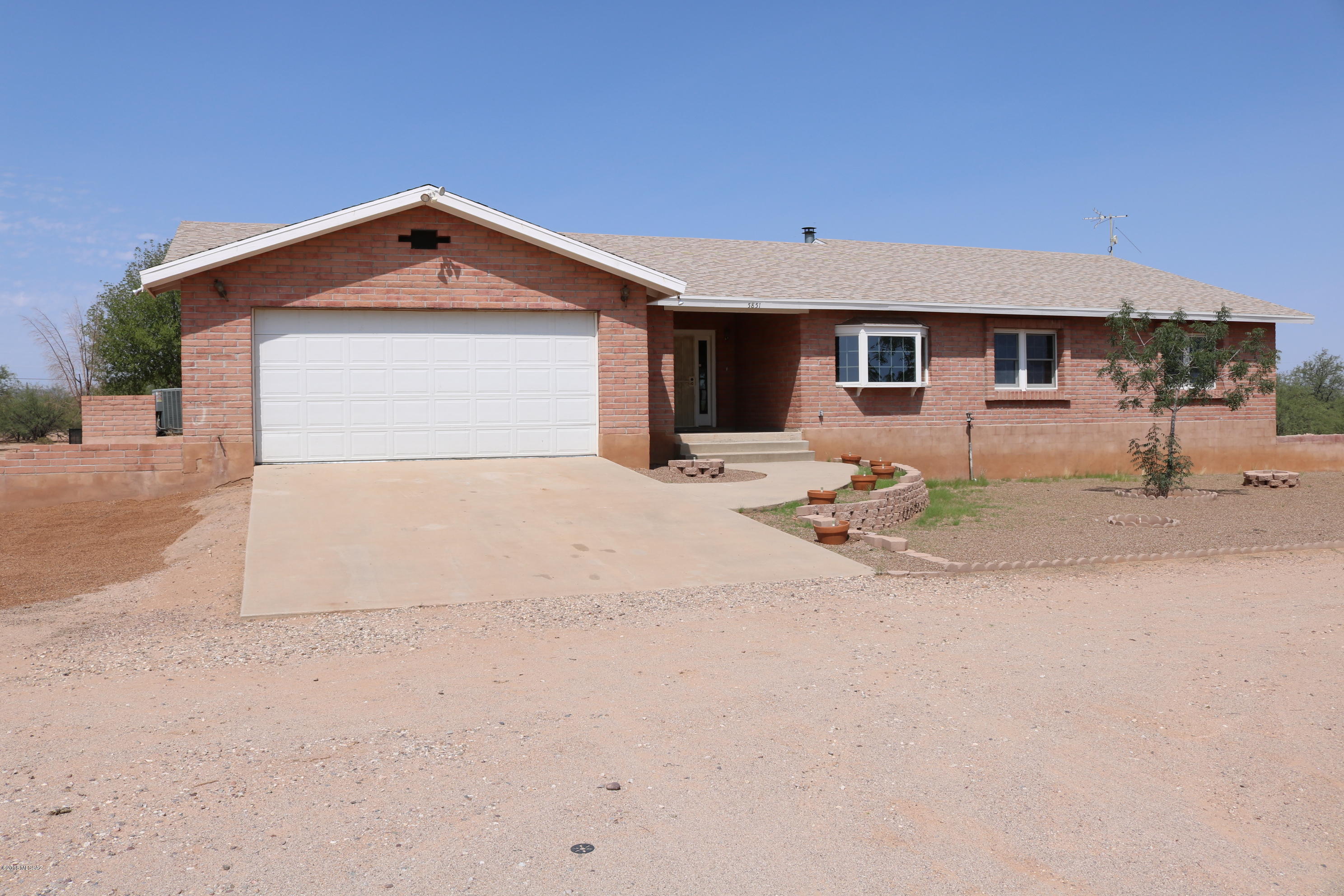 5851 South Avra Road Tucson, AZ 85735 - Photo 1 of 46 a view of a house with large outdoor space