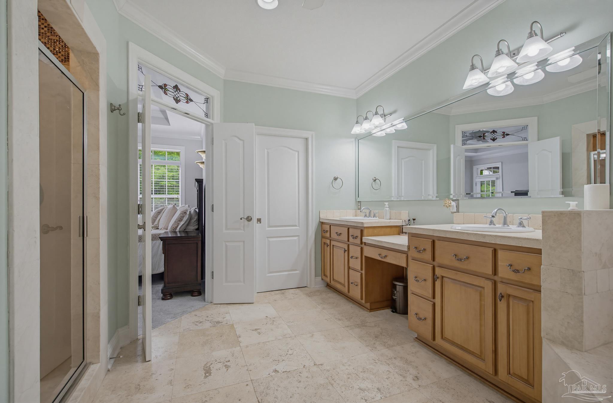 2855 Walling Road Milton, FL 32570 - Photo 29 of 55 a spacious bathroom with a granite countertop sink a toilet a mirror a vanity and shower