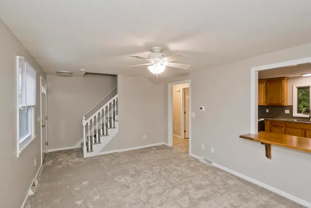 a view of entryway and hall with a chandelier