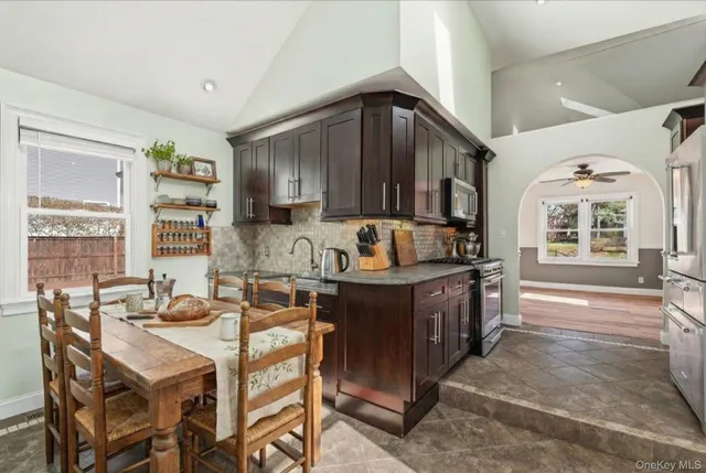 a kitchen with a stove a sink and a refrigerator