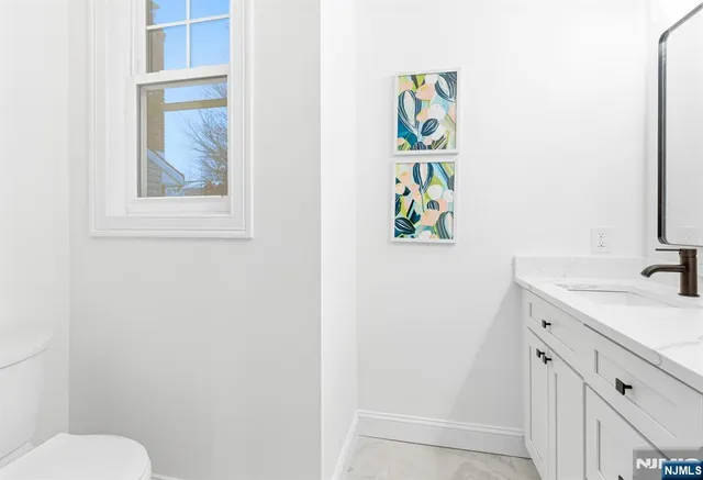 a bathroom with a sink and a window