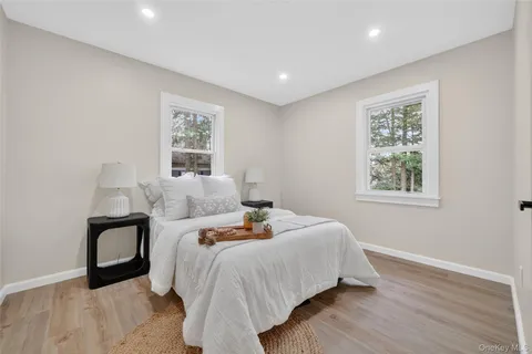 a bedroom with bed and a window