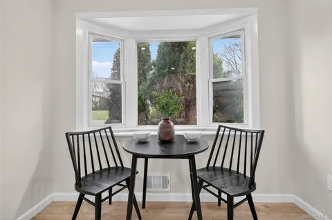 a view of a dining room with furniture window and outside view
