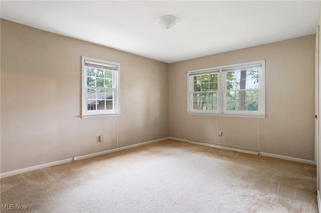 449 East Comet Road Clinton, OH 44216 - Photo 30 of 39 Bedroom 2 with carpet floors and baseboard heating