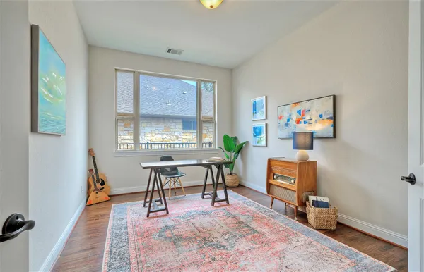 a workspace with furniture and window