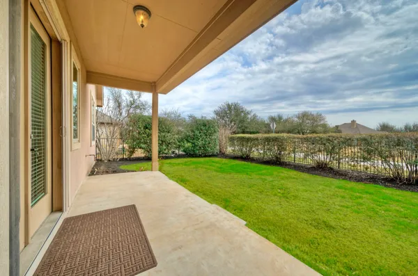 a view of a porch with a yard