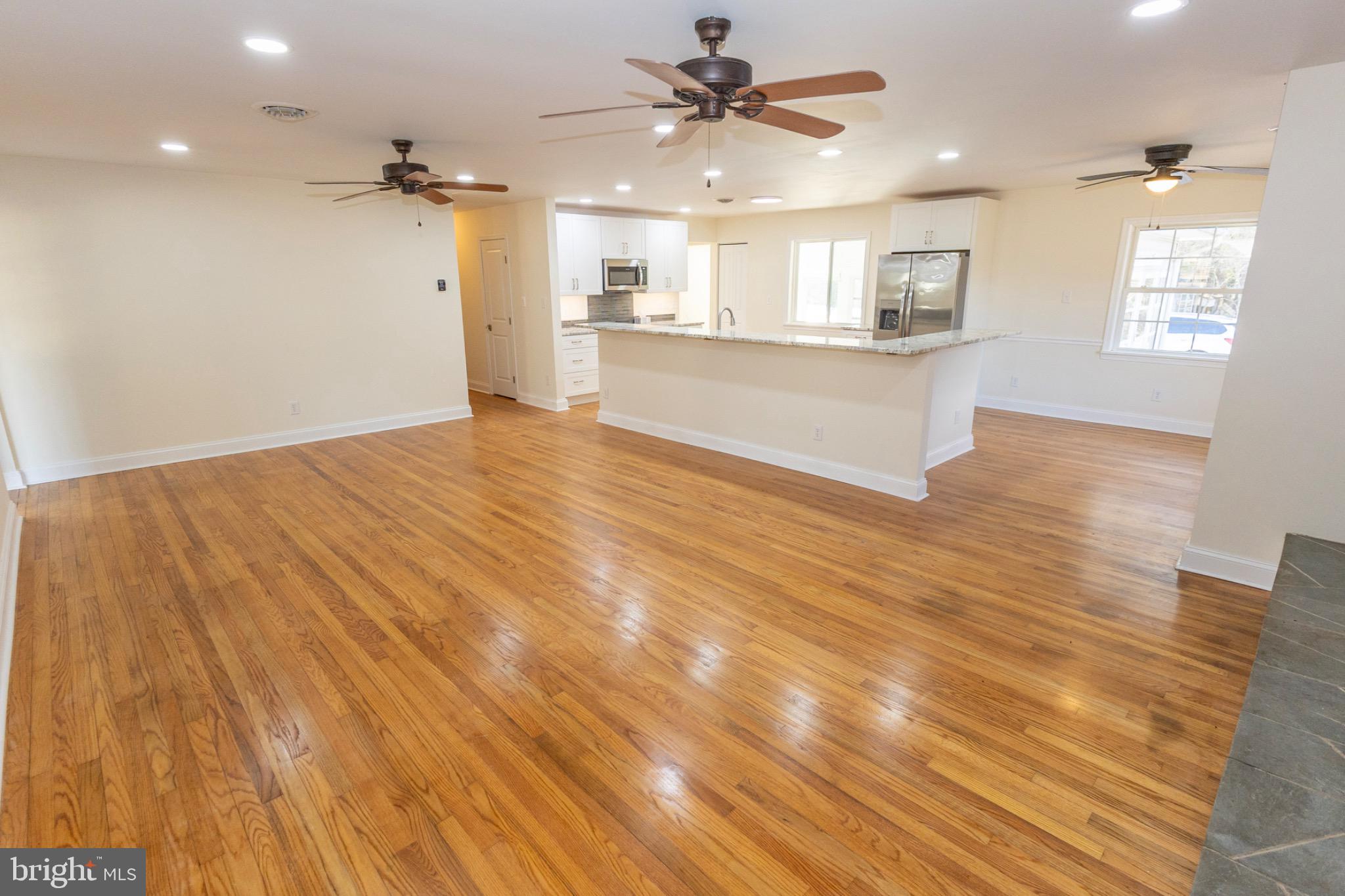 49151 Wynne Road Ridge, MD 20680 - Photo 12 of 80 Spacious, sunlit open living area.