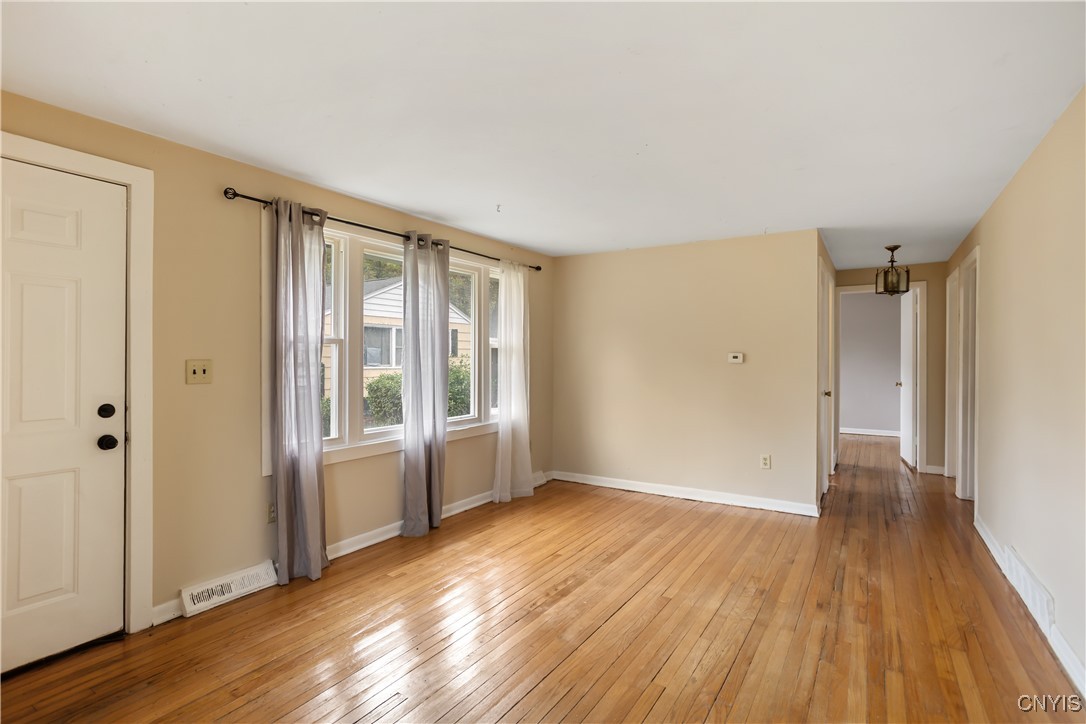 205 Crehange Street, Unit 7 Syracuse, NY 13205 - Photo 3 of 13 Large living/dining space w/ hardwood flooring