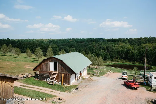 a aerial view of a house with a yard