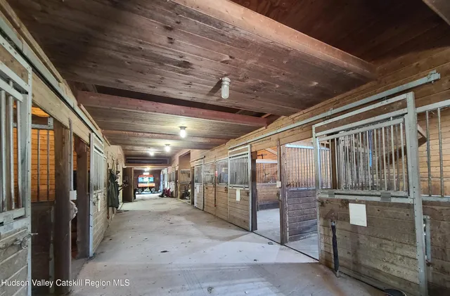 a room with stainless steel appliances a stove and cabinets