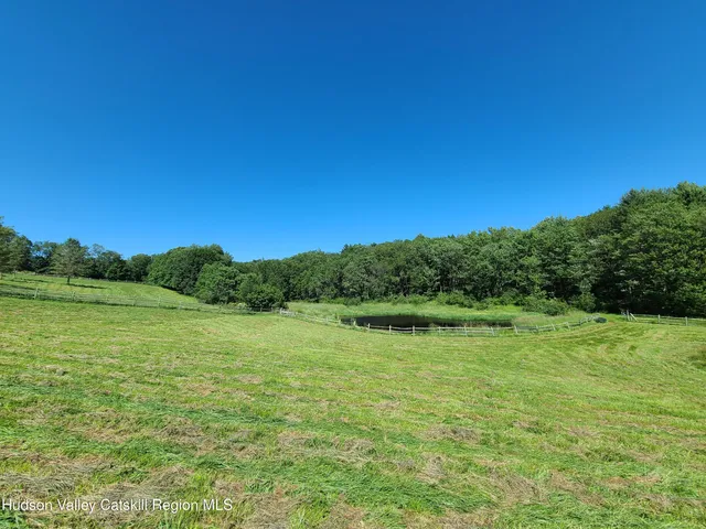 a view of a lake with houses in the back
