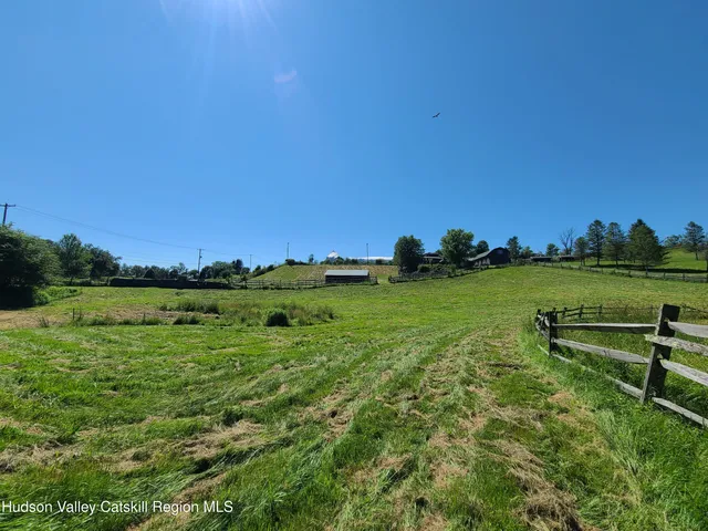 a view of a lake with a big yard