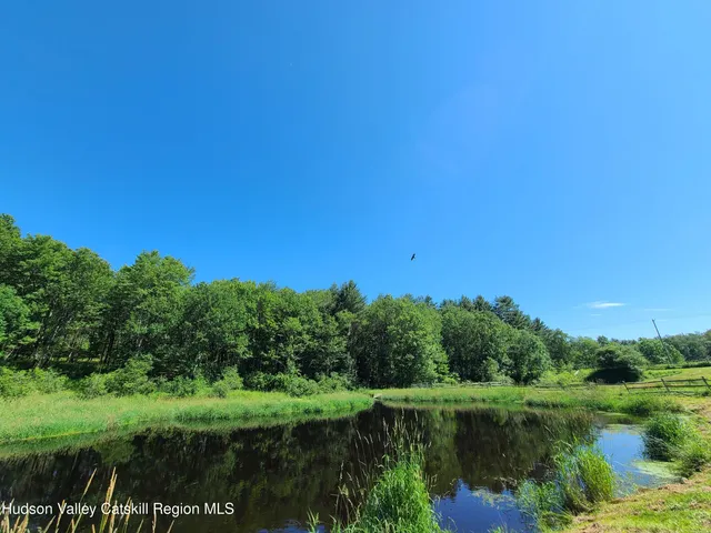 a view of a lake with a big yard