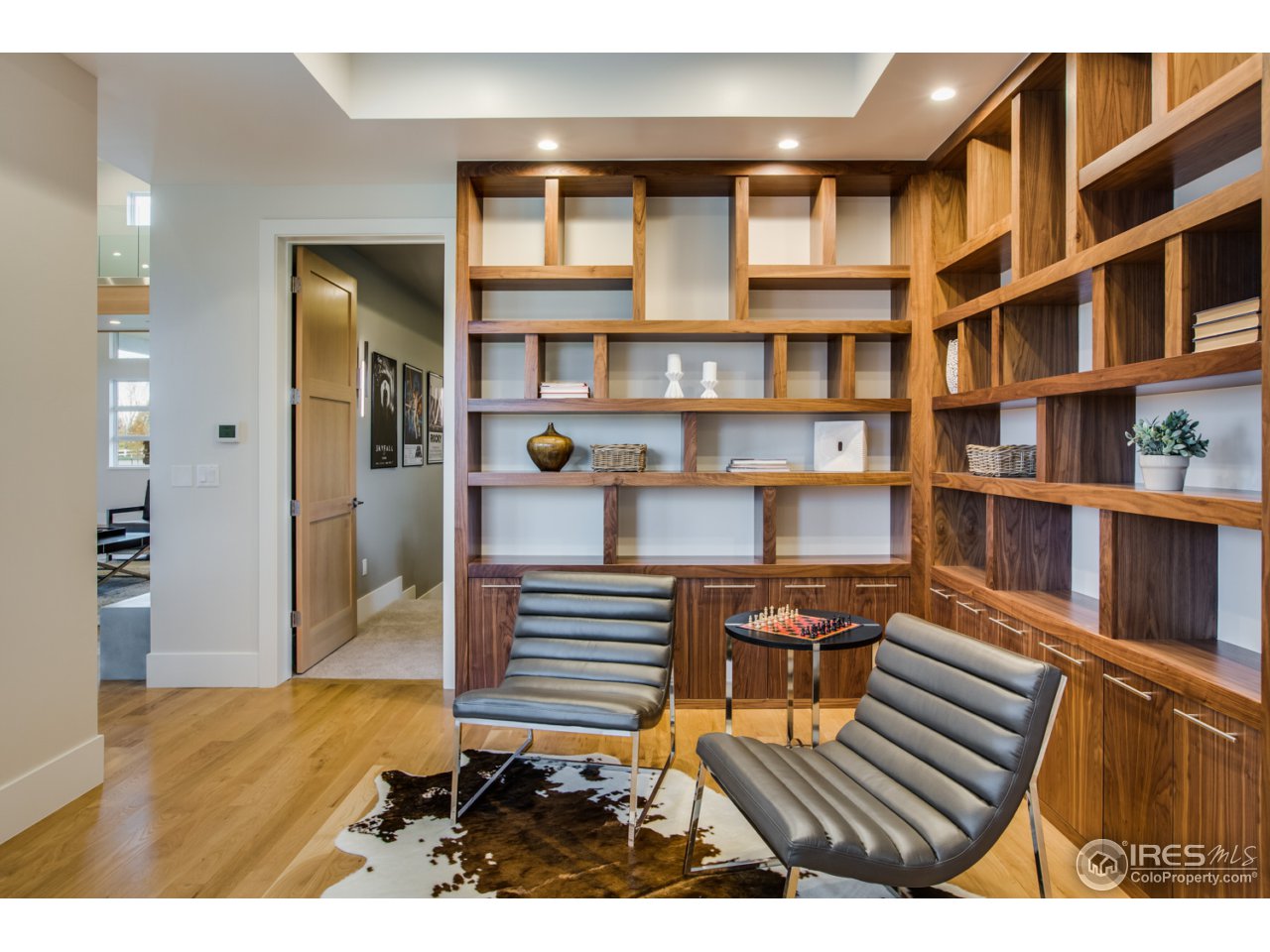 7412 Deerfield Road Longmont, CO 80503 - Photo 14 of 37 Cozy Library with Walnut Built-ins