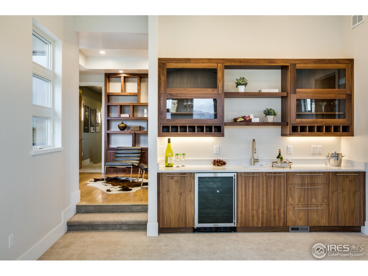 7412 Deerfield Road Longmont, CO 80503 - Photo 17 of 37 Family Room with Half-bath and Custom Wet Bar