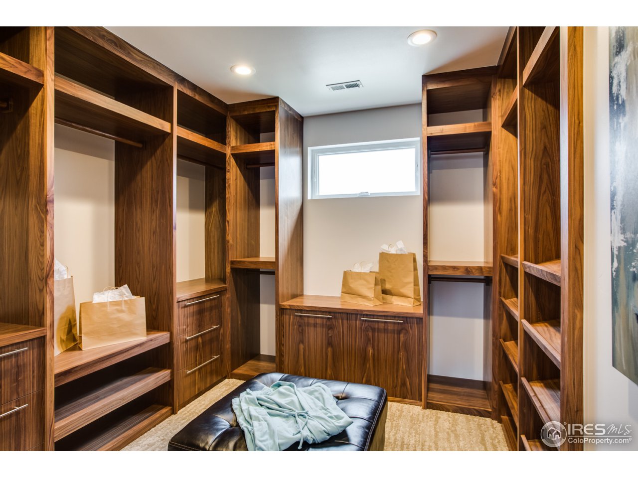 7412 Deerfield Road Longmont, CO 80503 - Photo 26 of 37 Expansive Master Closet with Walnut Built-ins