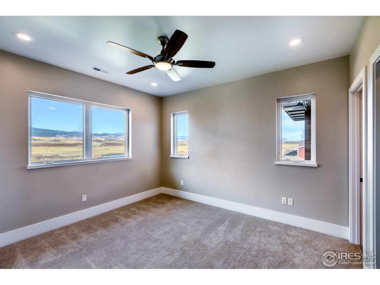 7412 Deerfield Road Longmont, CO 80503 - Photo 28 of 37 Southwest Bedroom Suite with Walk-in and Views!