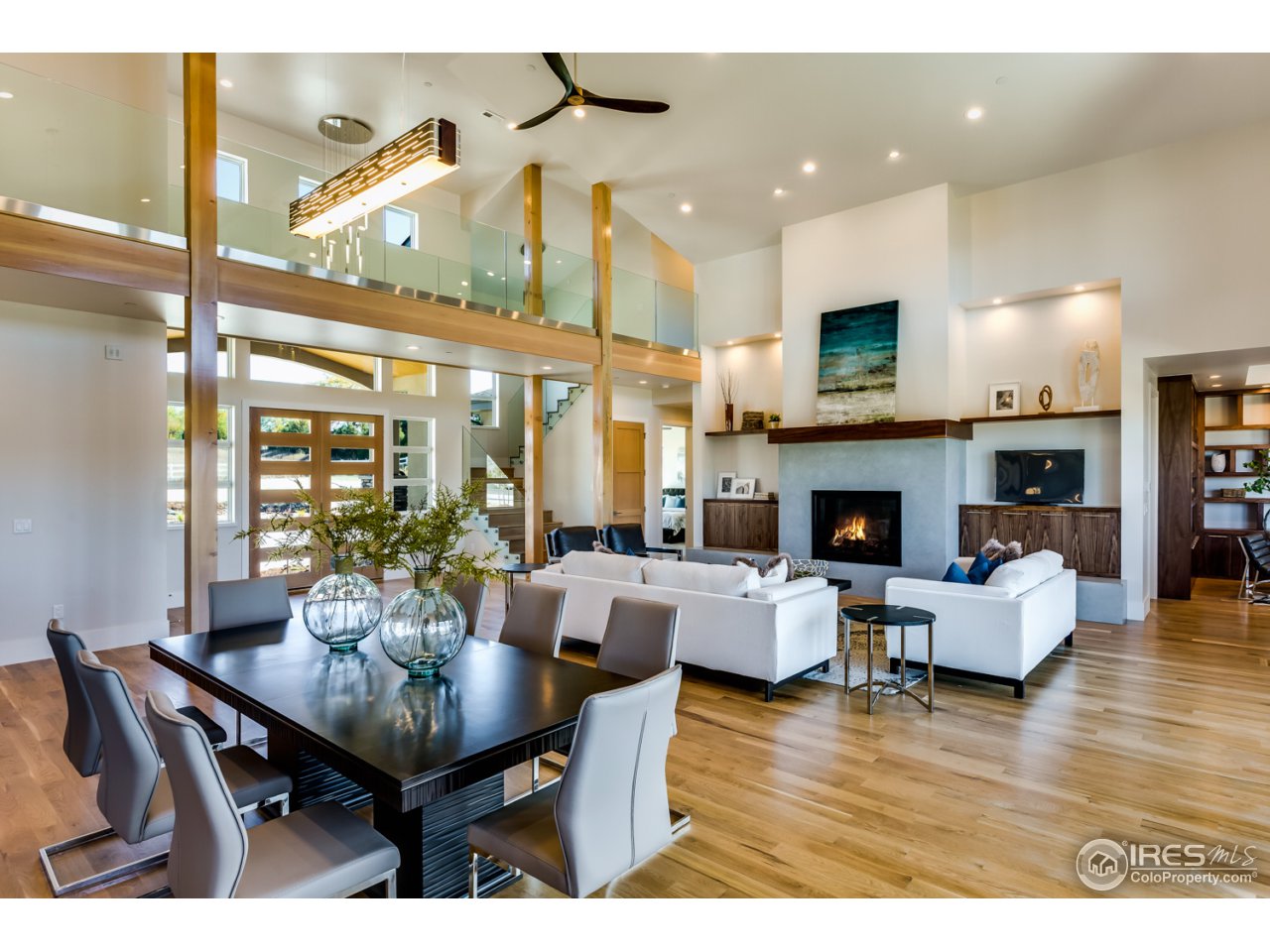 7412 Deerfield Road Longmont, CO 80503 - Photo 8 of 37 Great Room with 20' Vaulted Ceiling and Skybridge