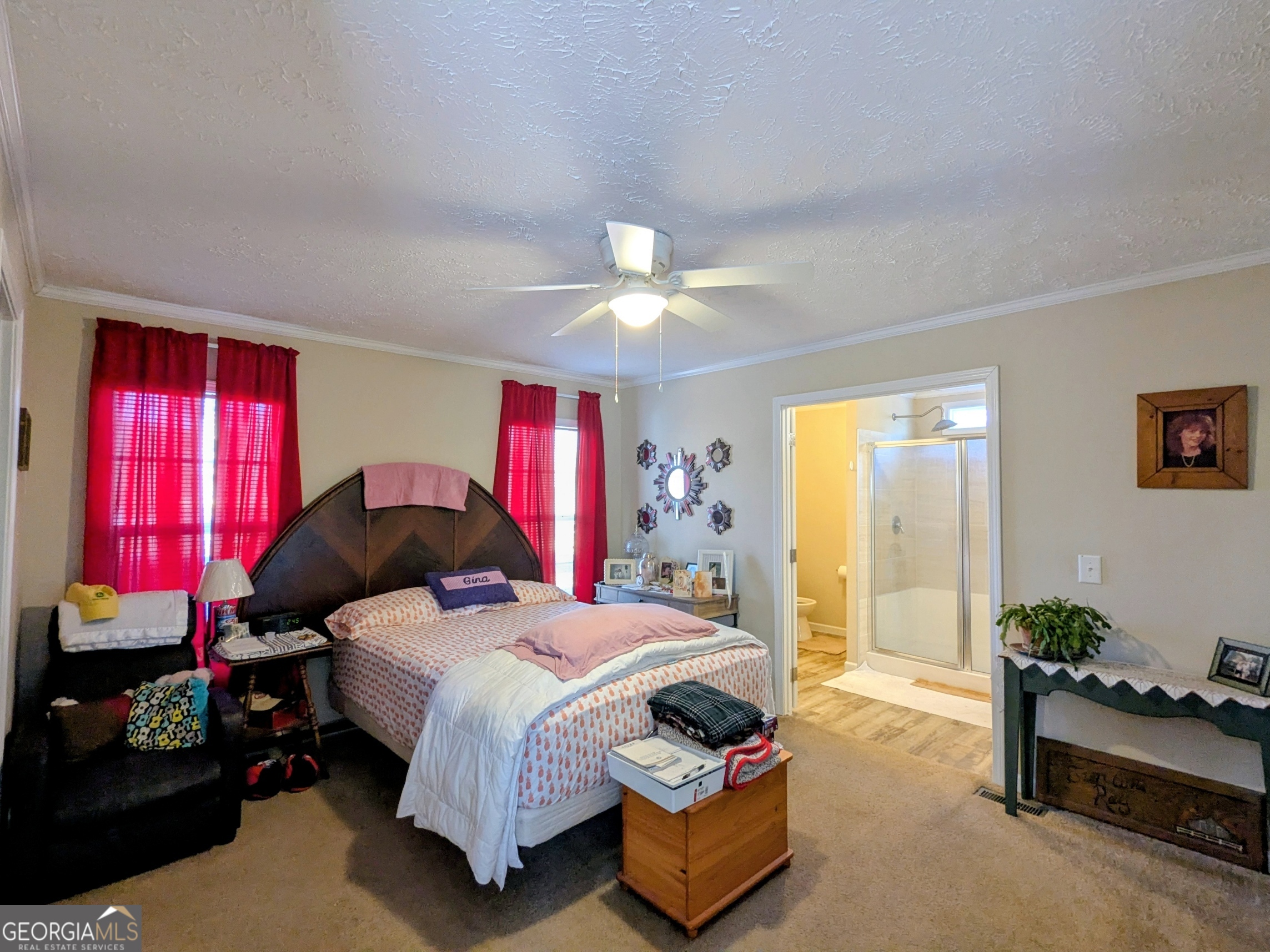 1282 Ga Highway Lyons, GA 30436 - Photo 13 of 21 a bedroom with a bed and a dresser next to a window