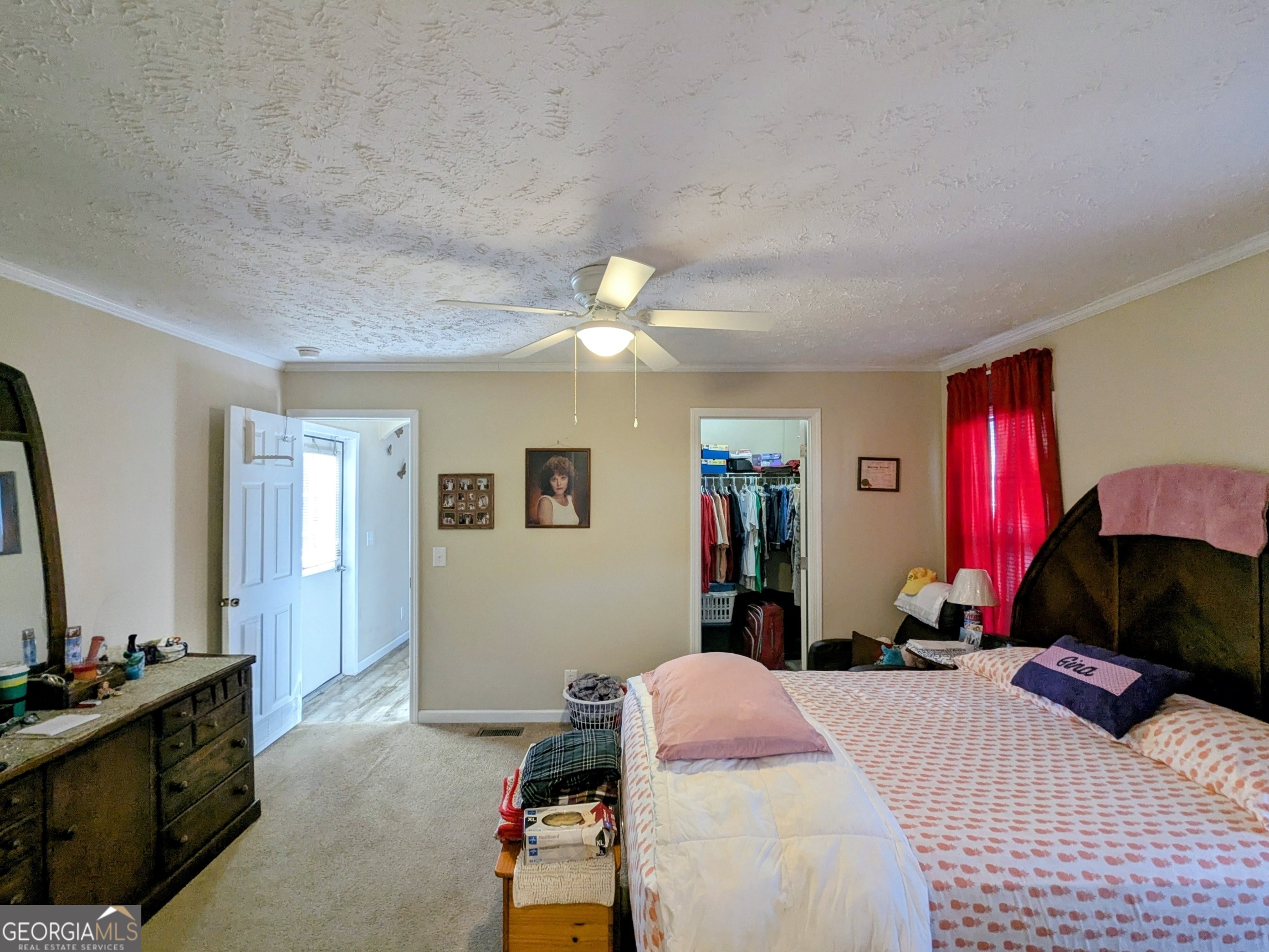1282 Ga Highway Lyons, GA 30436 - Photo 14 of 21 a bedroom with a bed and a chandelier