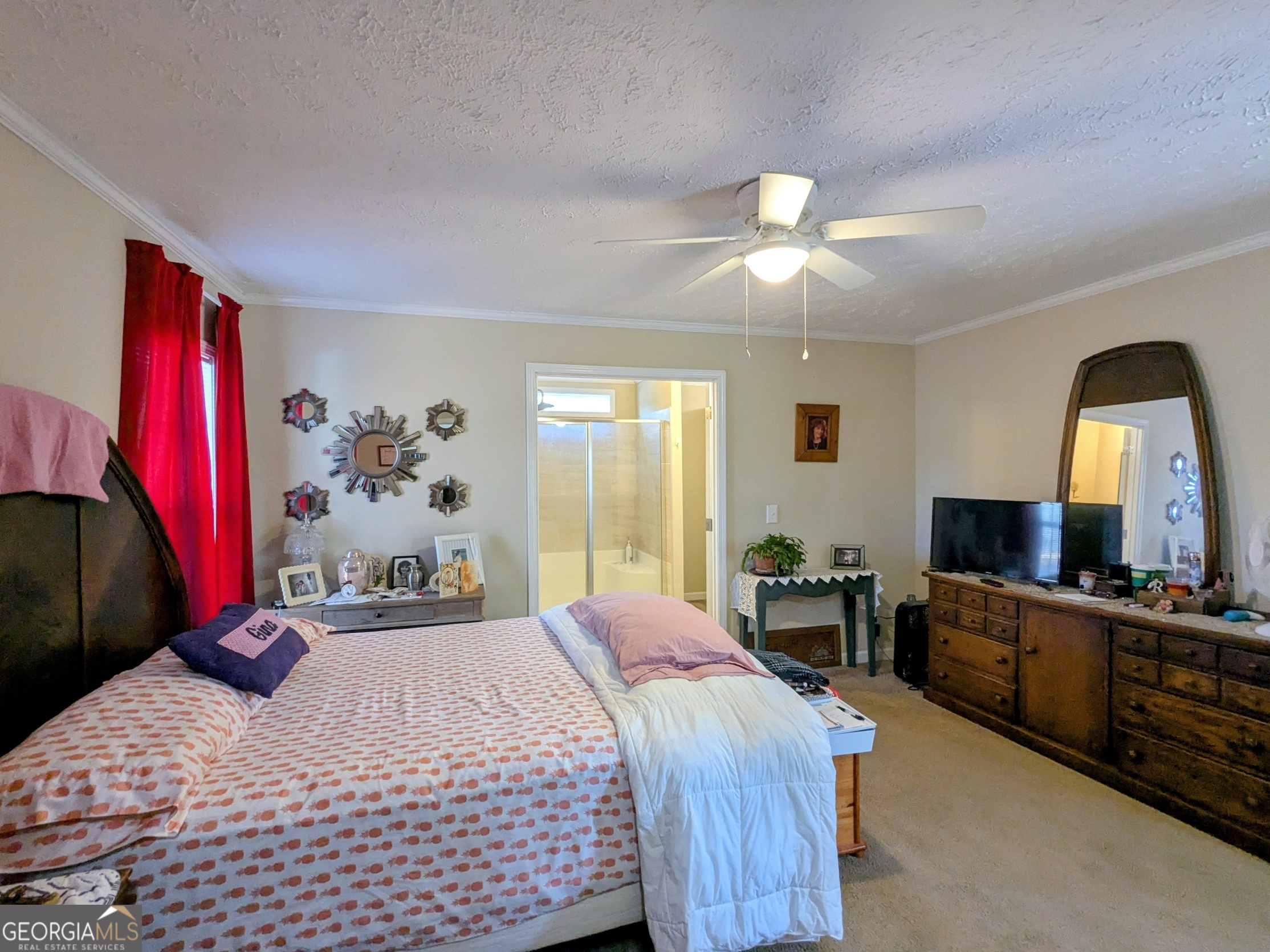 1282 Ga Highway Lyons, GA 30436 - Photo 15 of 21 a bedroom with a bed and a chandelier