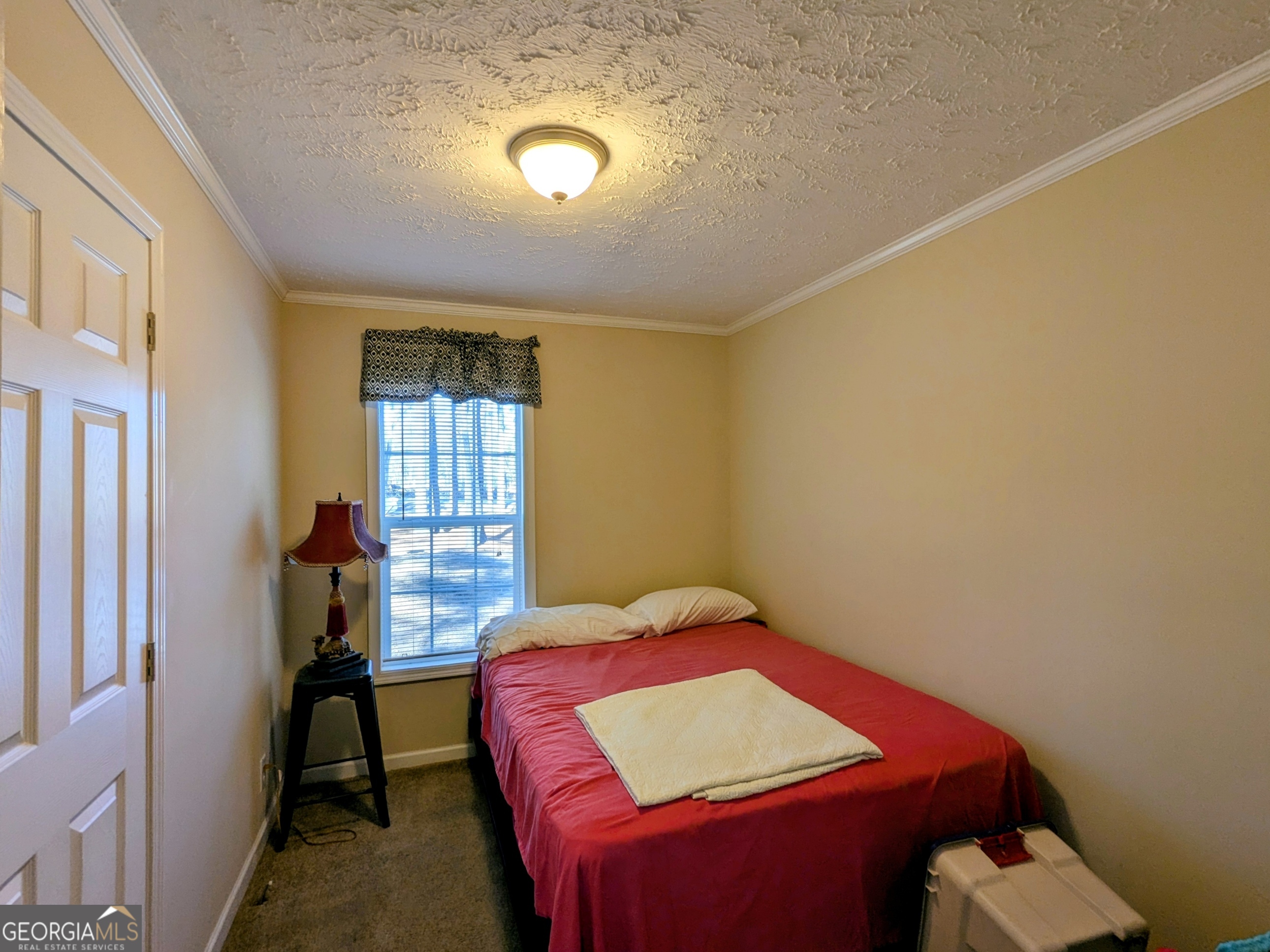 1282 Ga Highway Lyons, GA 30436 - Photo 19 of 21 a bedroom with a bed and a window
