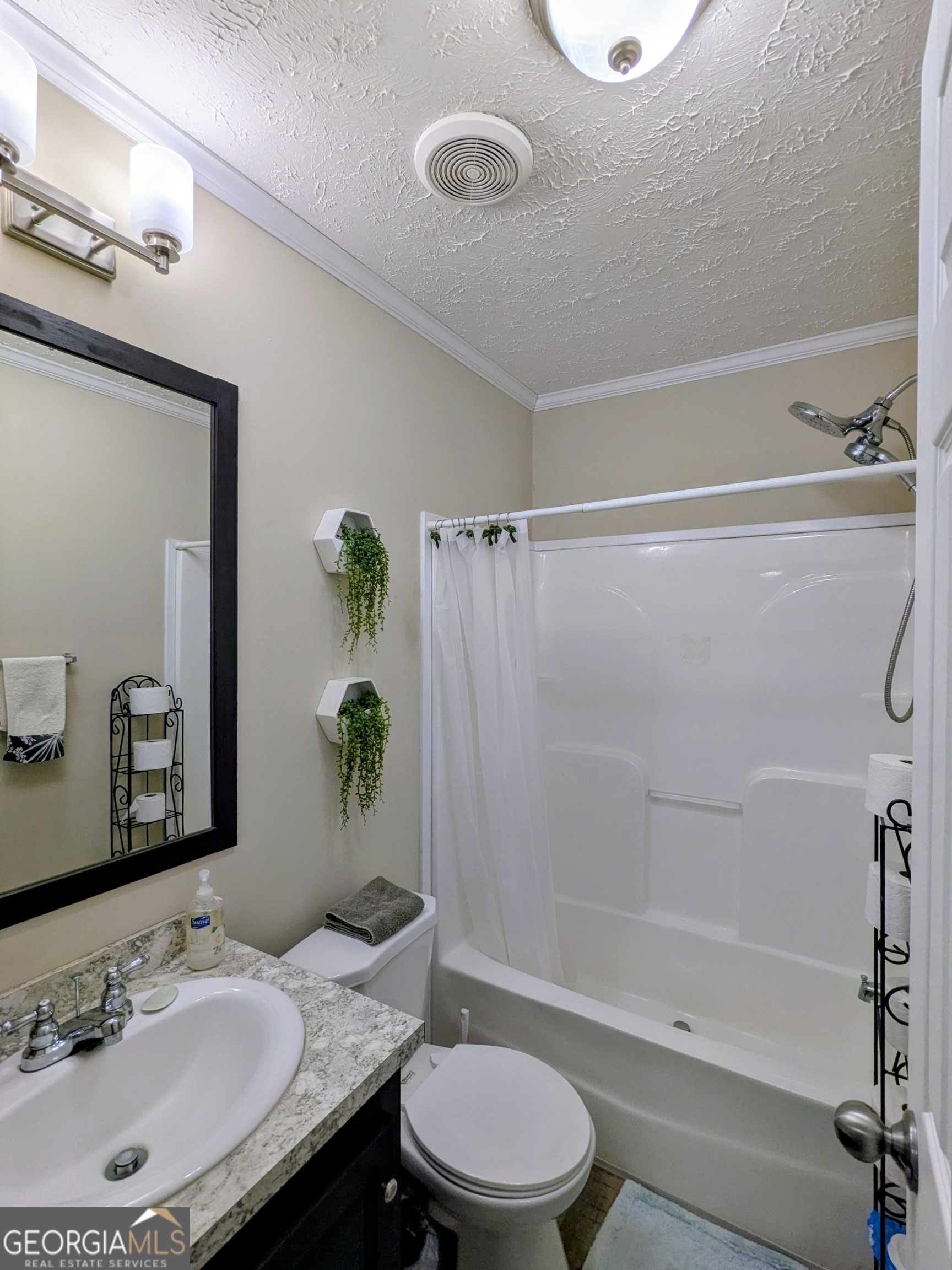 1282 Ga Highway Lyons, GA 30436 - Photo 20 of 21 a bathroom with a sink toilet and shower