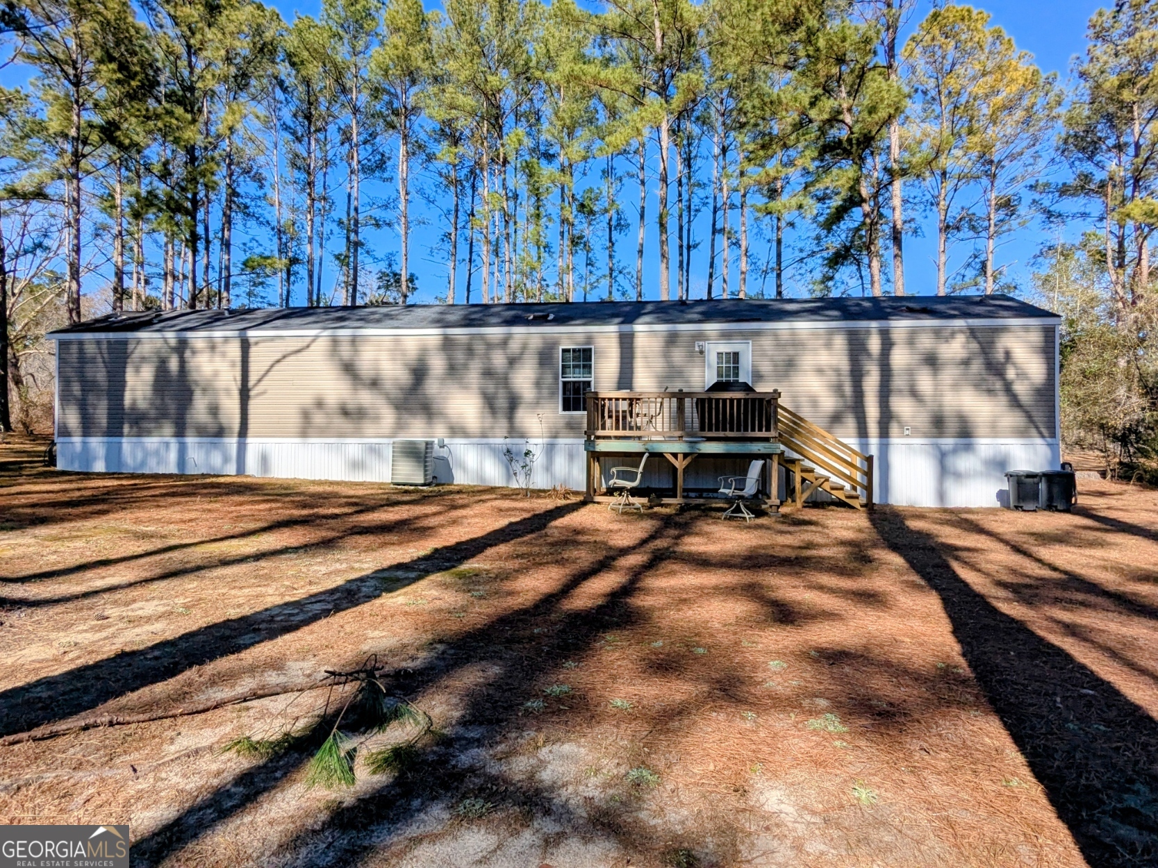 1282 Ga Highway Lyons, GA 30436 - Photo 2 of 21 a view of a backyard with wooden fence