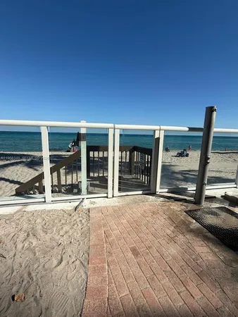 a view of a house with a wooden deck
