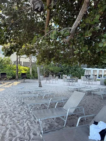 a view of a backyard with sitting area