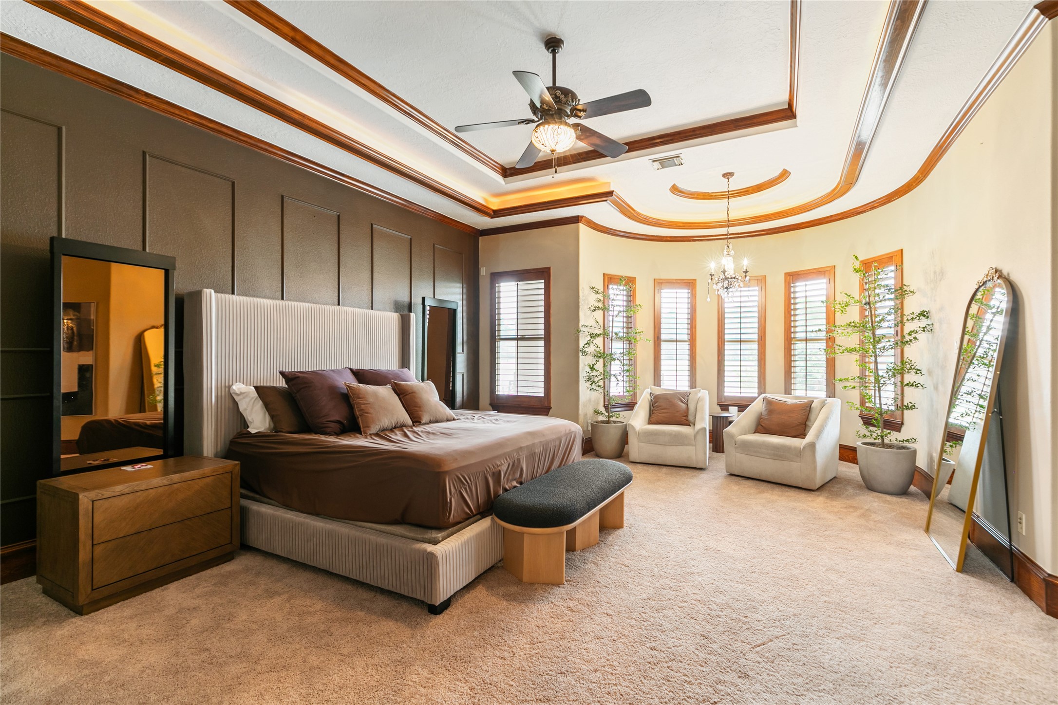 22 Post Shadow Estate Drive Spring, TX 77389 - Photo 40 of 50 a spacious bedroom with a bed a couch and a chandelier