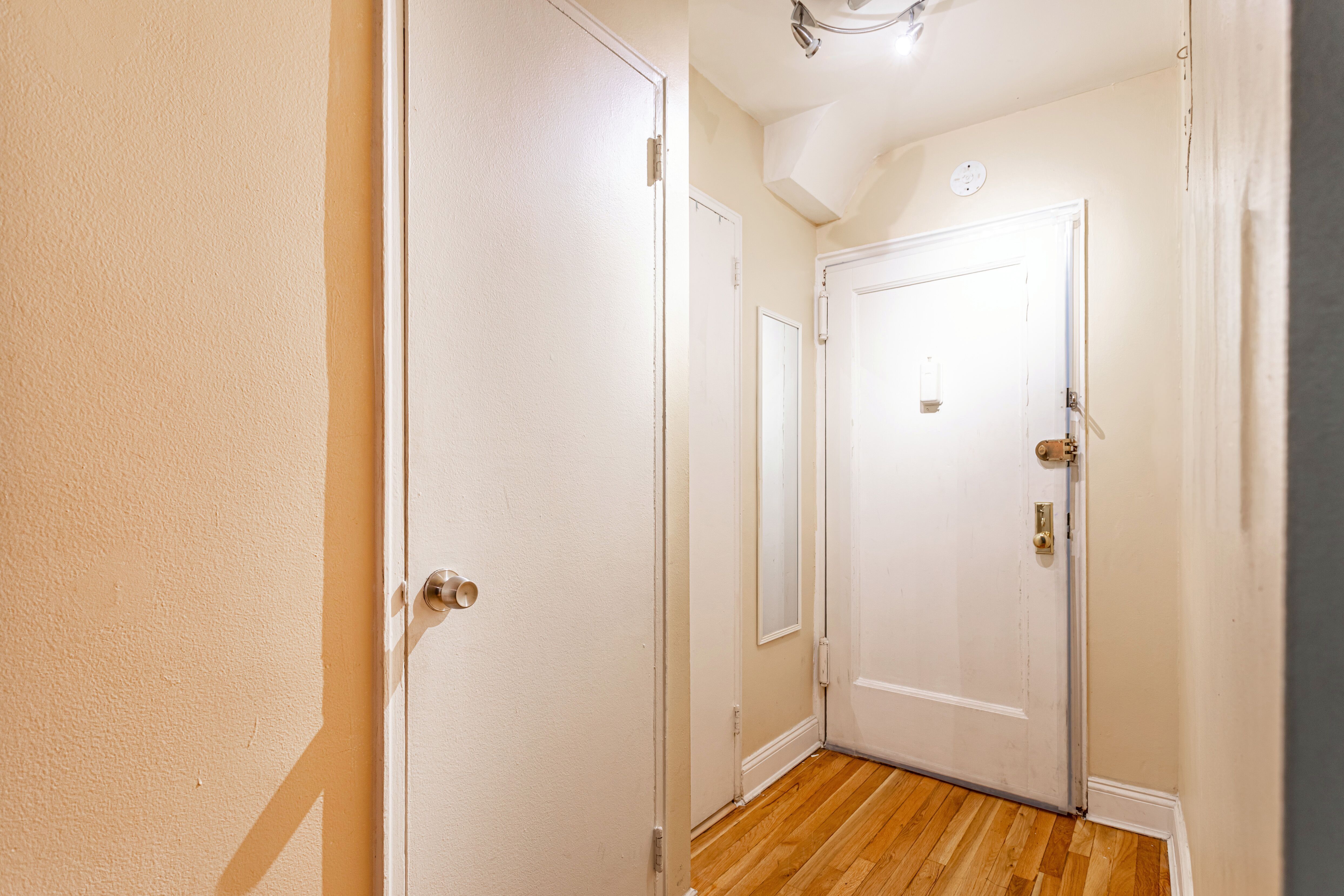65-15 38th Avenue, Unit 2A Queens, NY 11377 - Photo 11 of 16 a view of a hallway with wooden floor