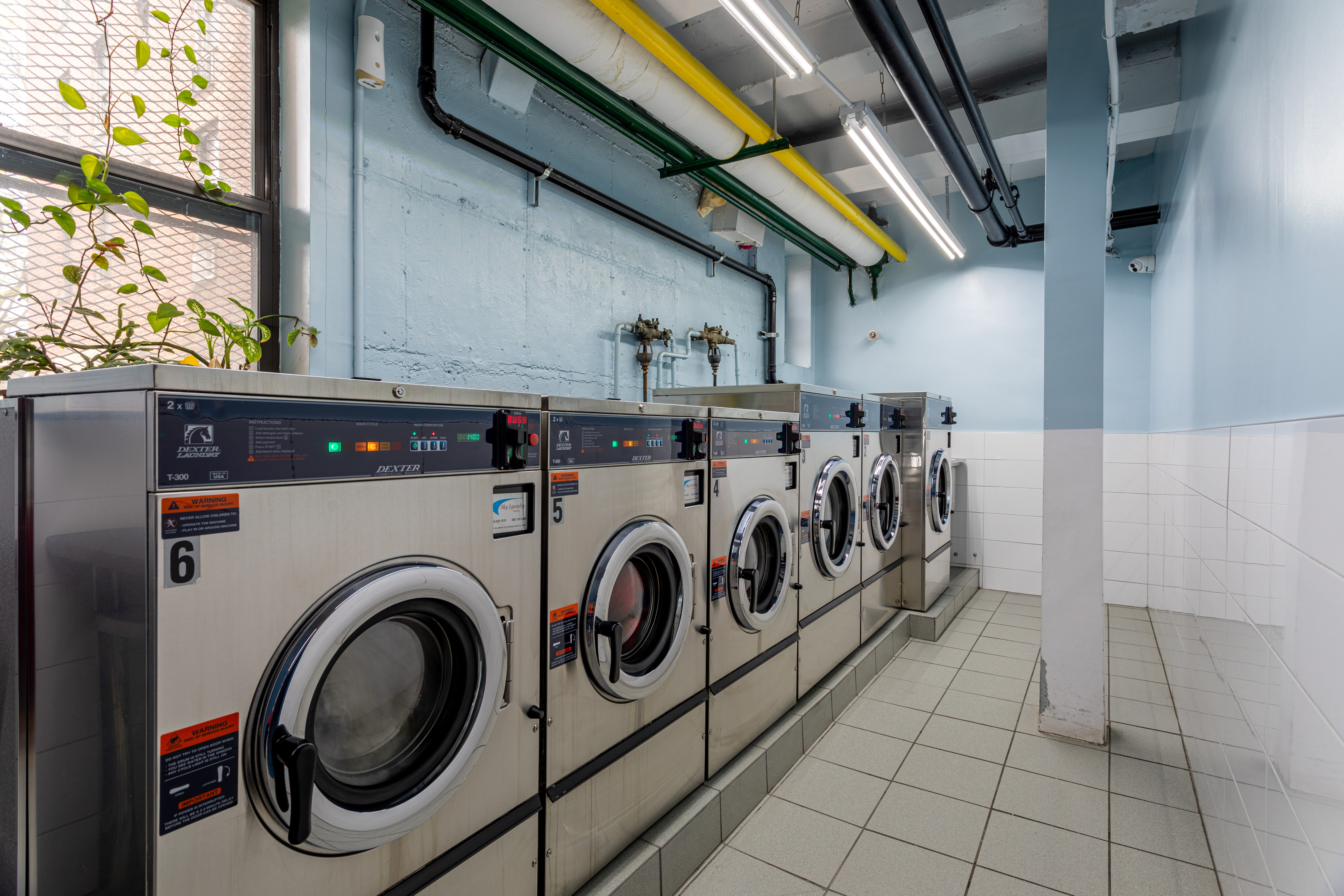 65-15 38th Avenue, Unit 2A Queens, NY 11377 - Photo 14 of 16 a utility room with dryer and washer