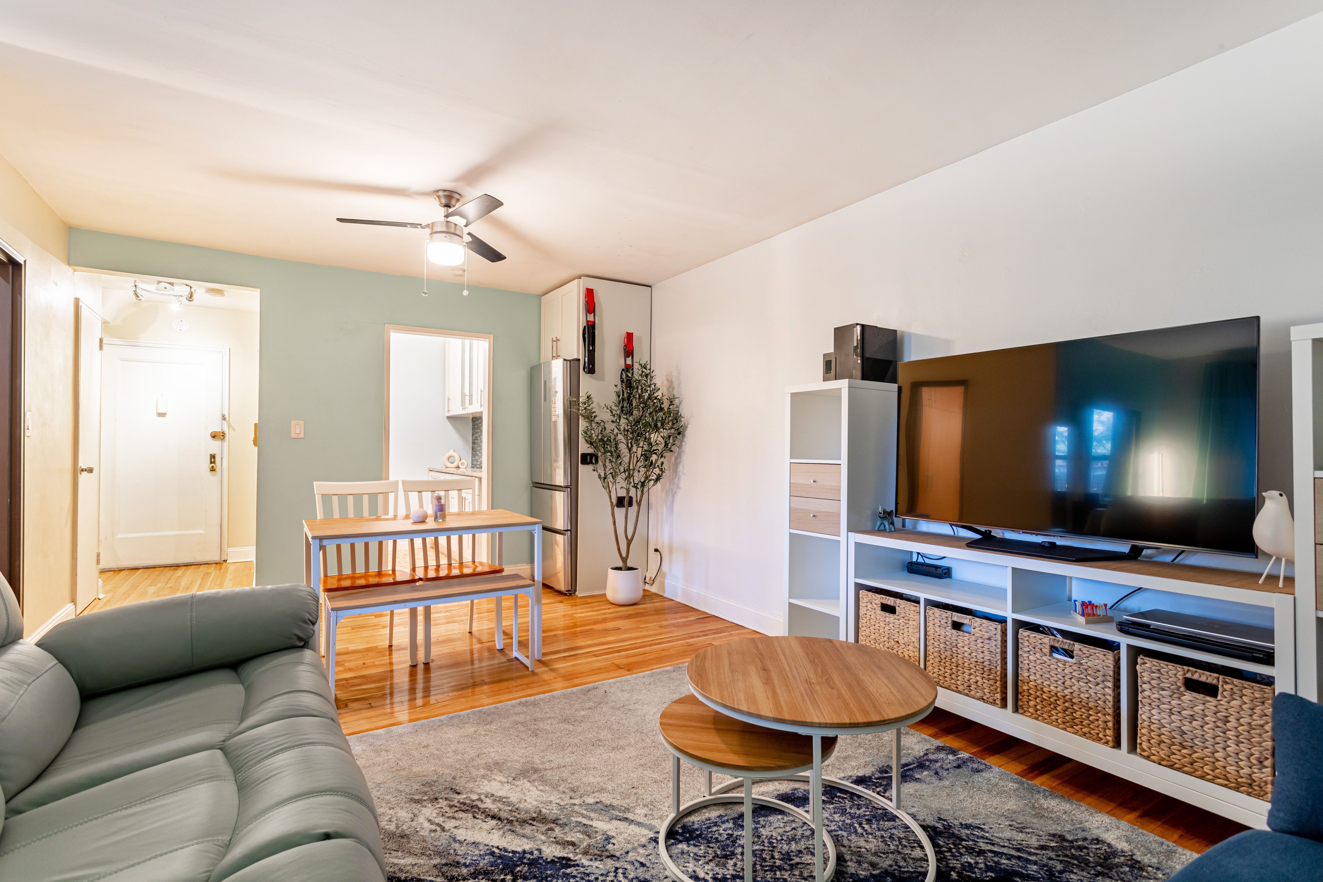 65-15 38th Avenue, Unit 2A Queens, NY 11377 - Photo 3 of 16 a living room with furniture and a flat screen tv