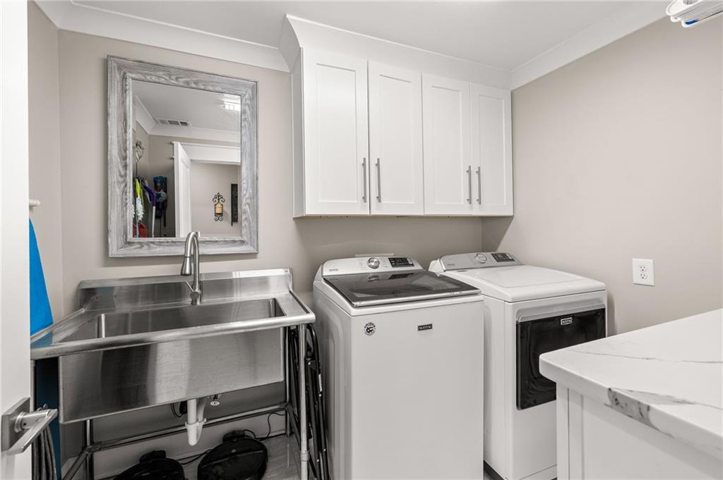 6470 Samoa Way Flowery Branch, GA 30542 - Photo 49 of 61 a kitchen that has a stove and a table chair