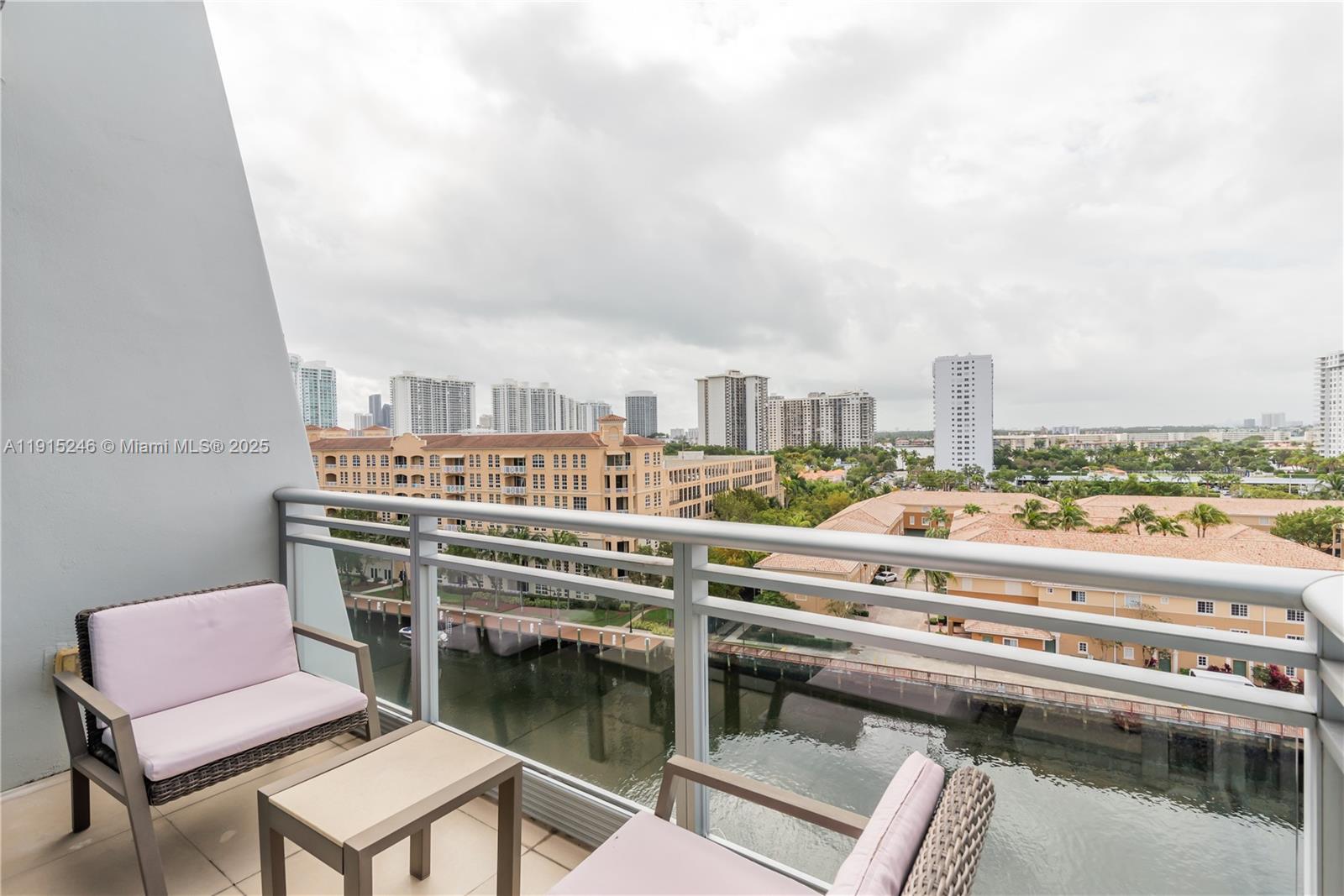 2950 Northeast 188th Street, Unit 504 Aventura, FL 33180 - Photo 15 of 33 a view of a balcony with chairs