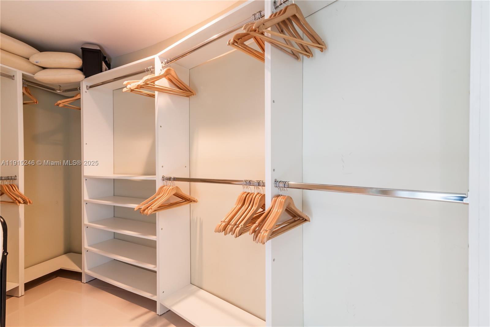 2950 Northeast 188th Street, Unit 504 Aventura, FL 33180 - Photo 24 of 33 a view of walk in closet with empty racks