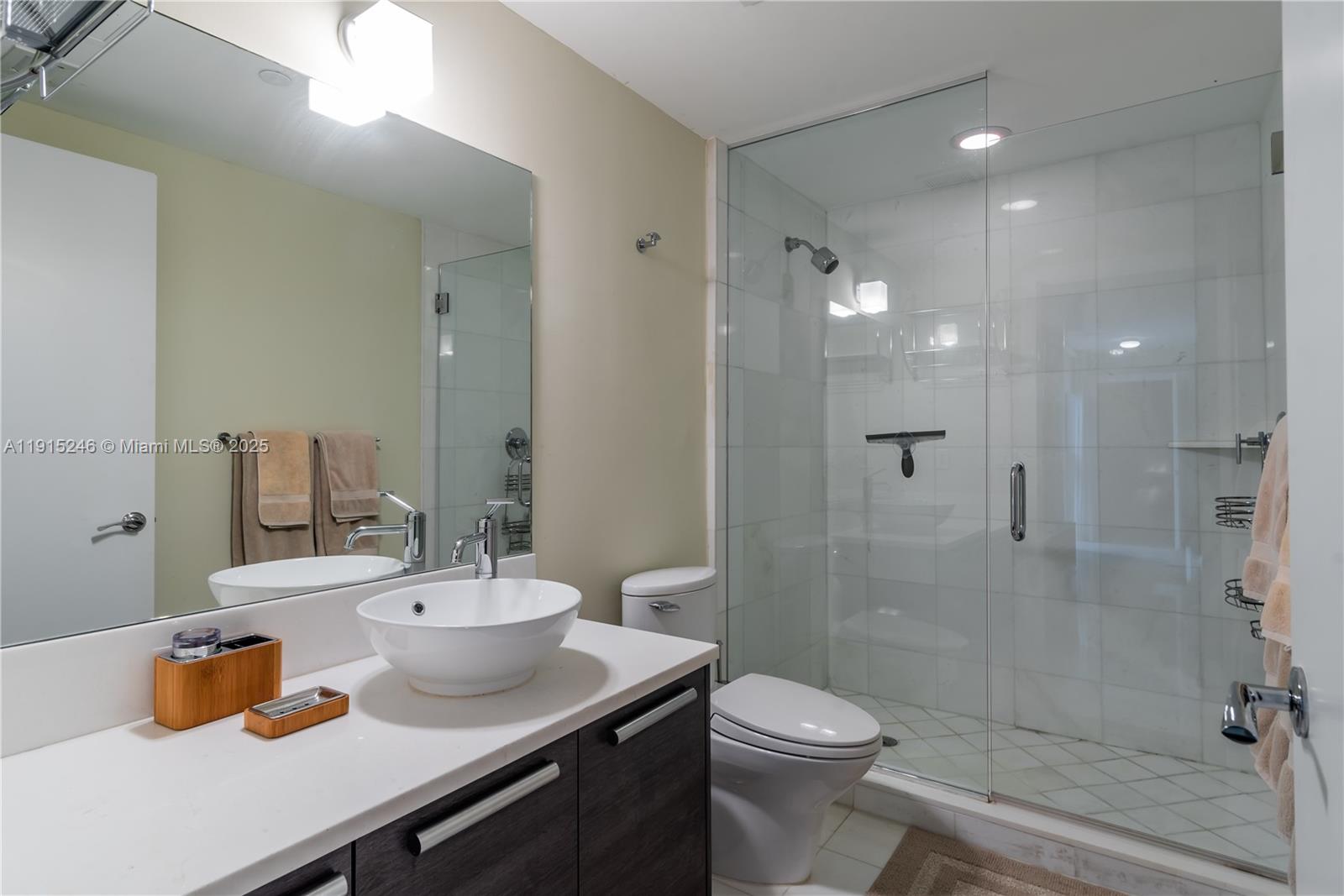 2950 Northeast 188th Street, Unit 504 Aventura, FL 33180 - Photo 33 of 33 a bathroom with a sink a toilet and shower