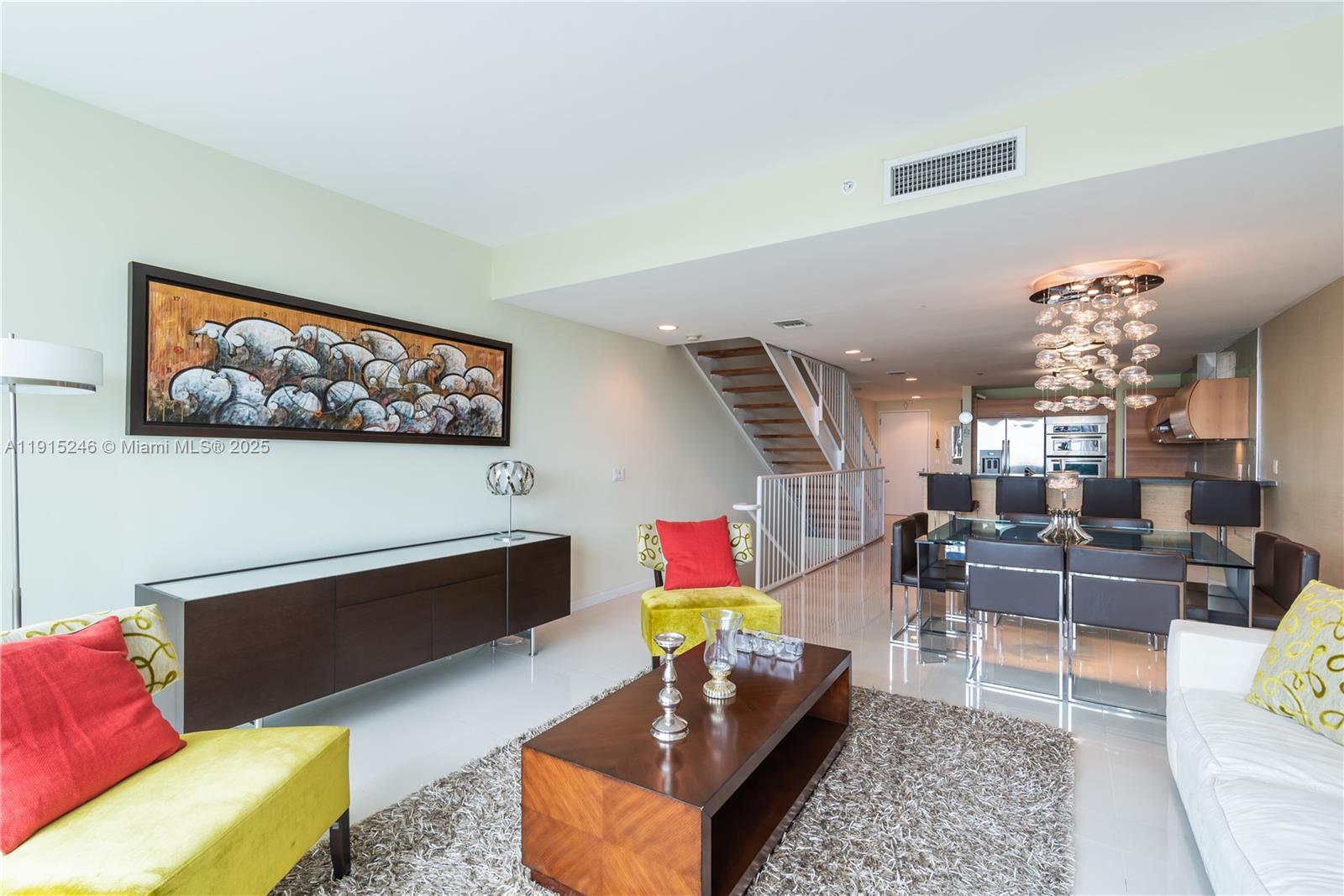 2950 Northeast 188th Street, Unit 504 Aventura, FL 33180 - Photo 10 of 33 a living room with furniture fireplace and rug