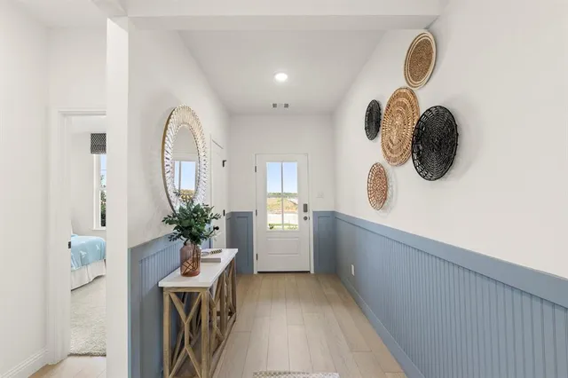 a bathroom with a sink mirror and vanity