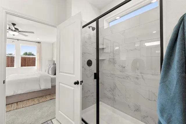 a bathroom with a shower and a sink