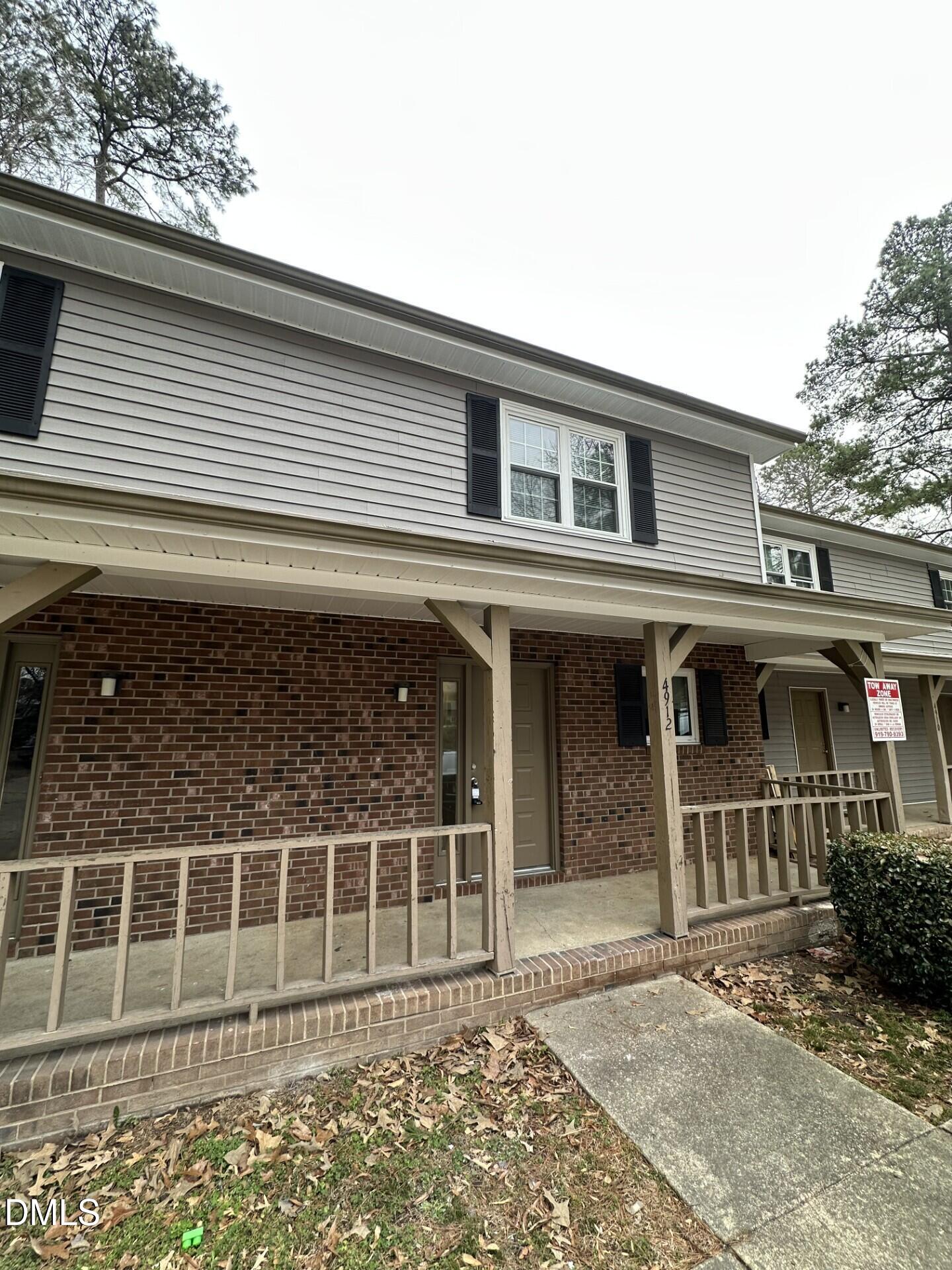 a front view of a house with a garage