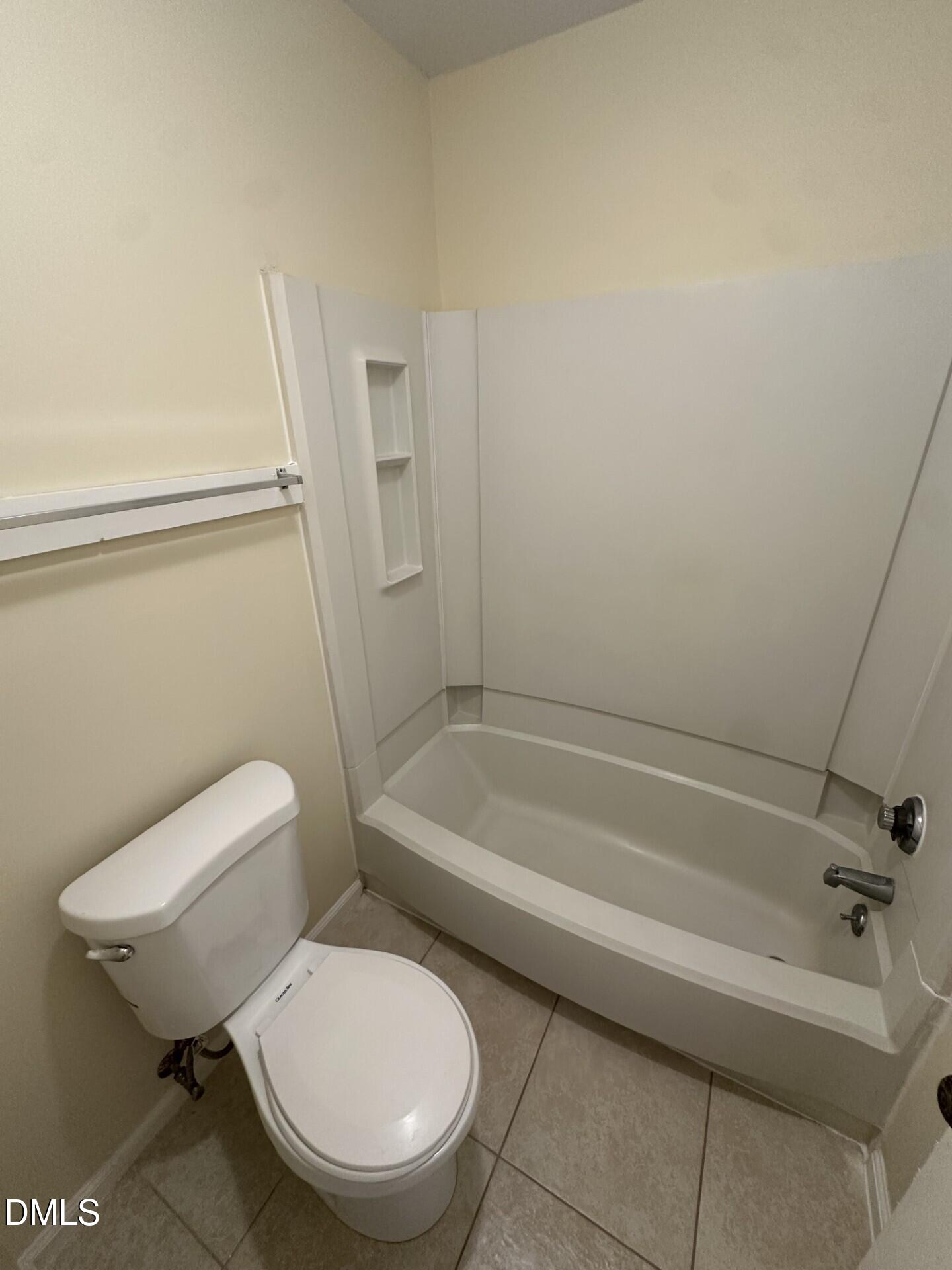 4912 North New Hope Road Raleigh, NC 27616 - Photo 14 of 14 a white toilet sitting next to a bath tub