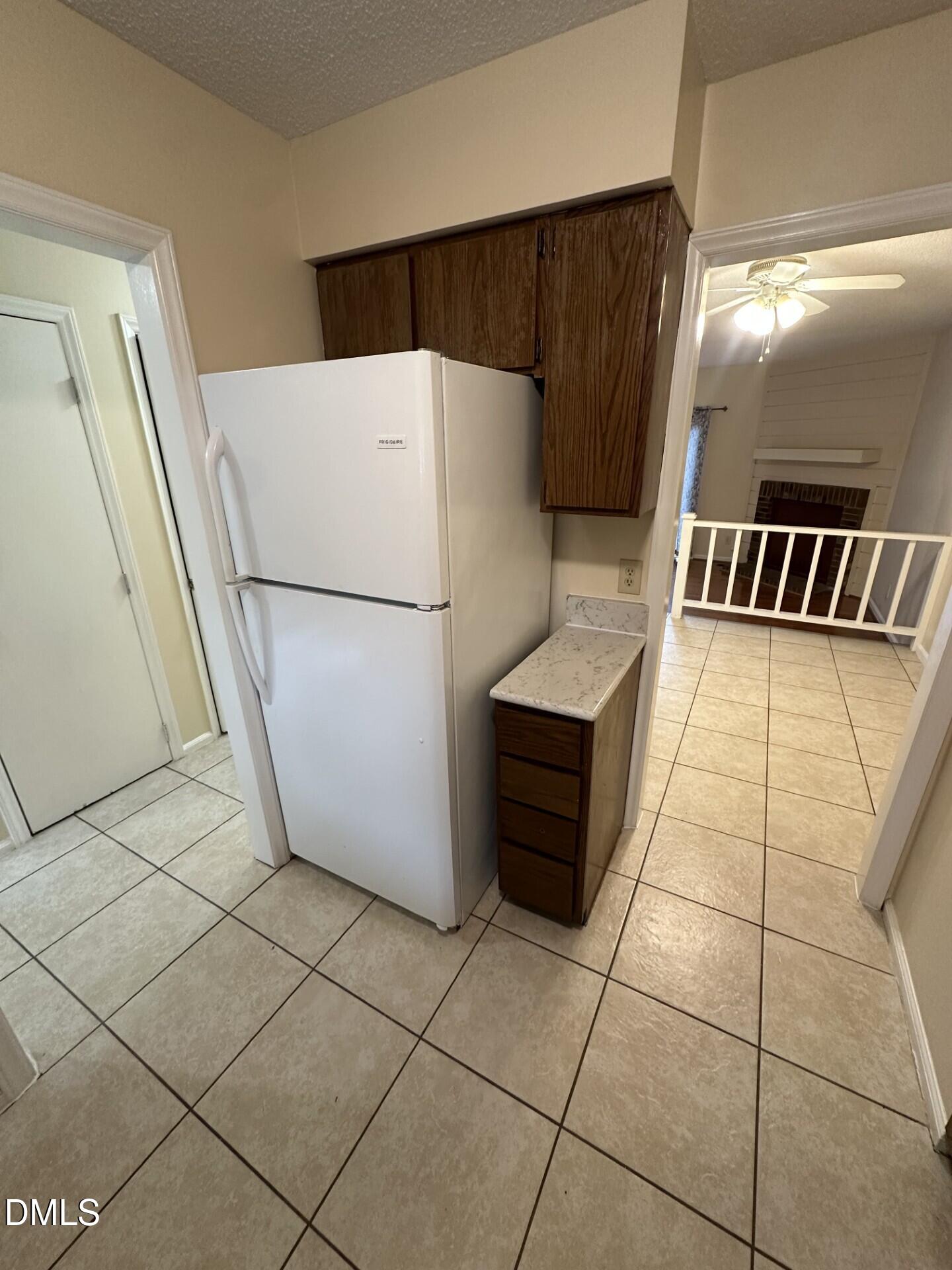 4912 North New Hope Road Raleigh, NC 27616 - Photo 3 of 14 a white refrigerator freezer and a stove sitting inside of a kitchen